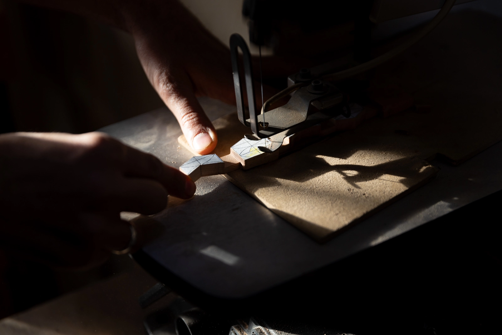 Master craftsmen demonstrating intricate wood carving techniques