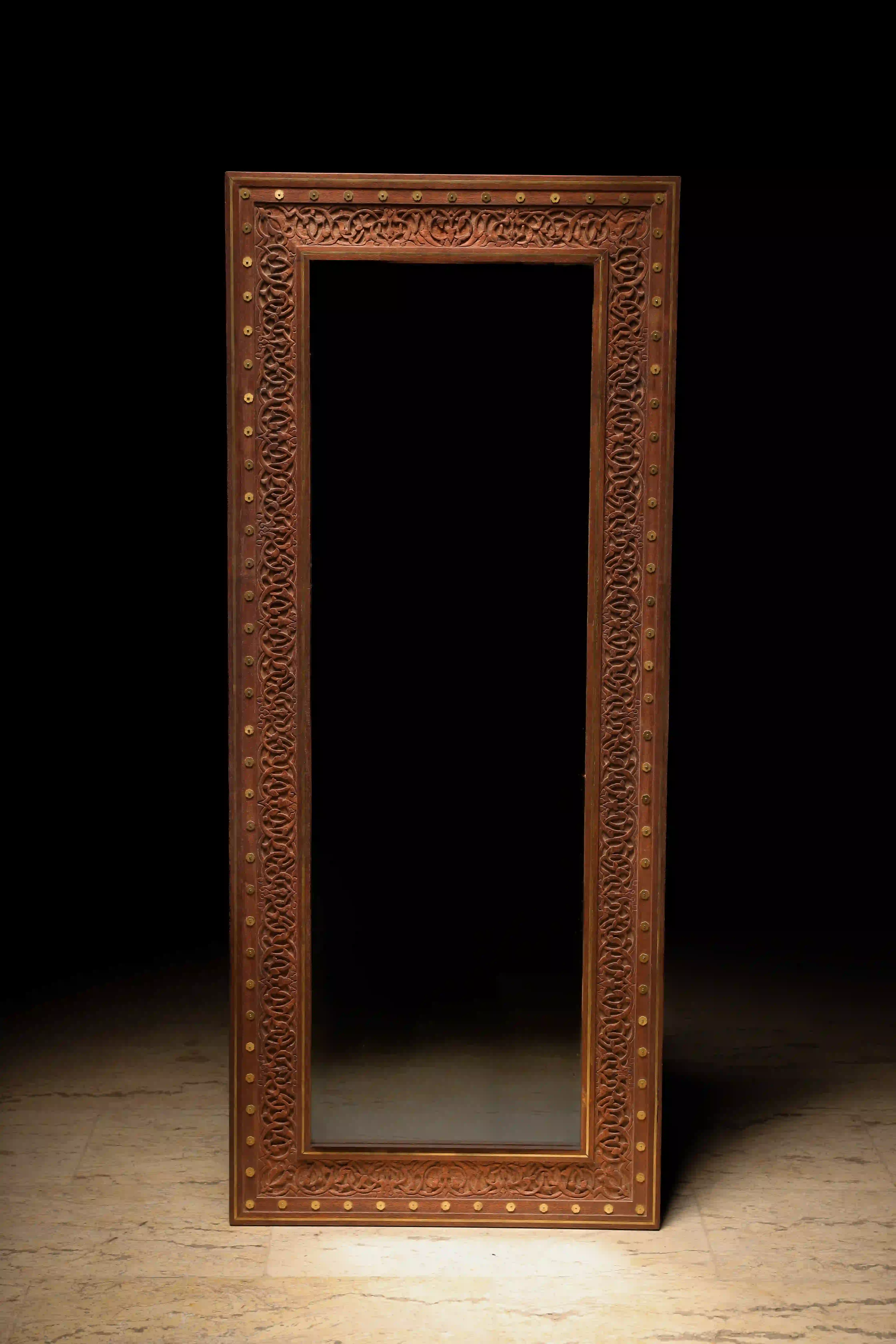 Rana Meligui - Carved wooden wall mirror frame with embossed brass details