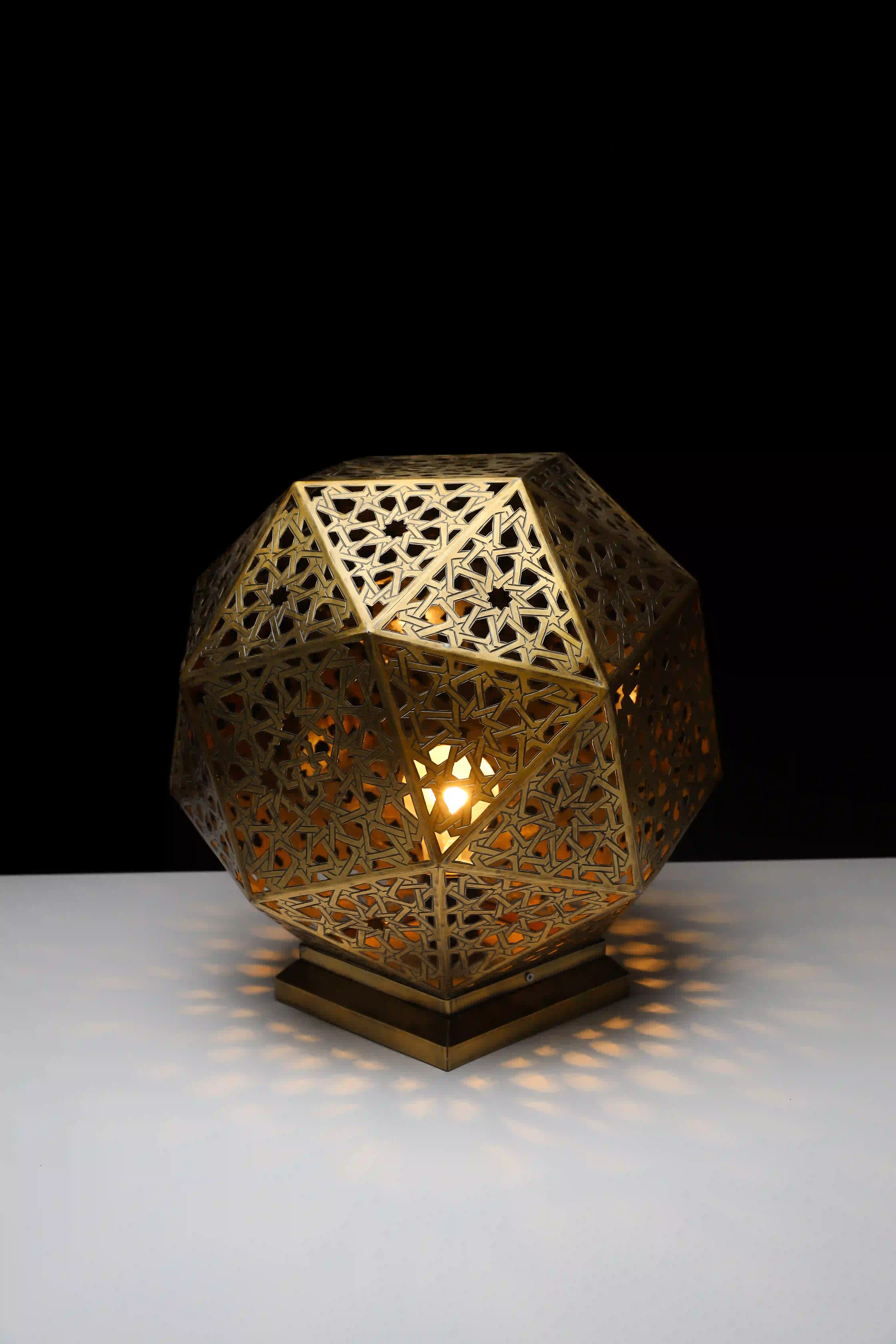 Areej Niazy - Brass polyhedron lighting unit with a Moroccan-Andalusian pattern